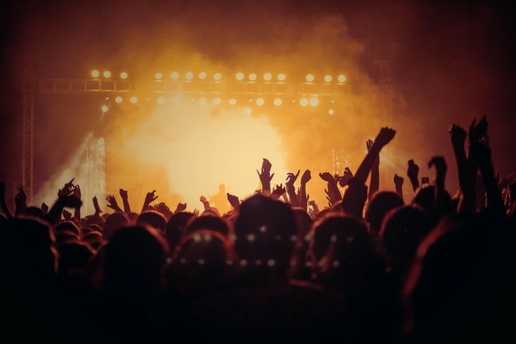 Crowd celebrating with confetti at a Limbofest event