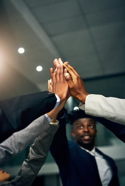Team members stacking hands together