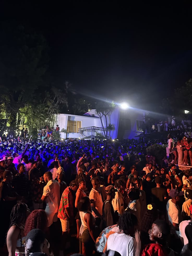 Crowd at a Limbofest-produced concert with stage lighting